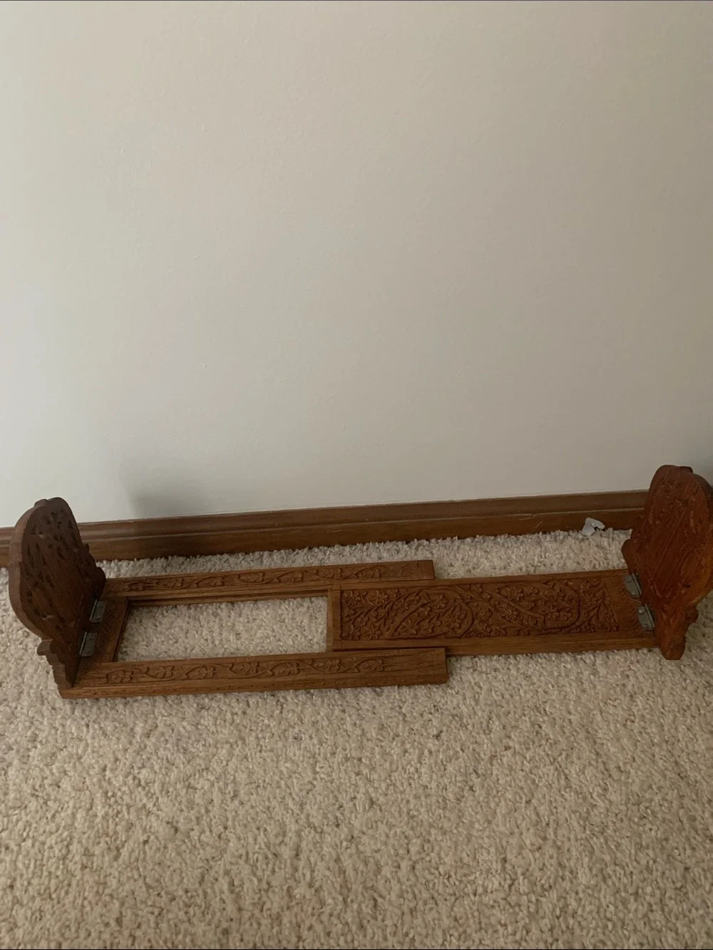 Vintage hand carved expanding book rack.
